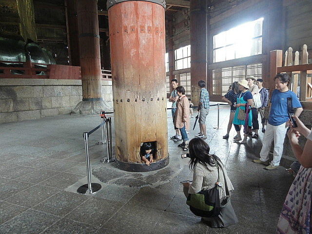 Crawling though 'enlightenment' pillar at Todai-ji