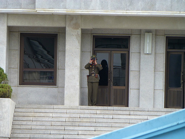 Watched through binoculars by a KPA soldier