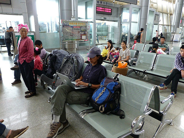 Catching up on offline work at Kunming Bus Station