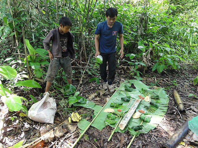 Lunch laid over banana leaves. Note soup in bamboo