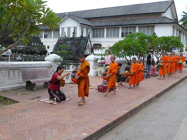 Monks receiving alms