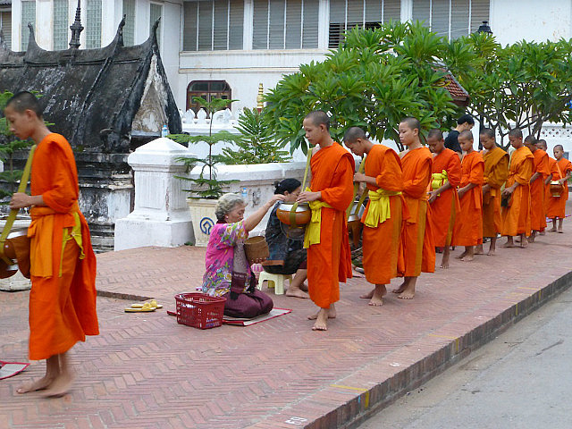 Monks receiving alms