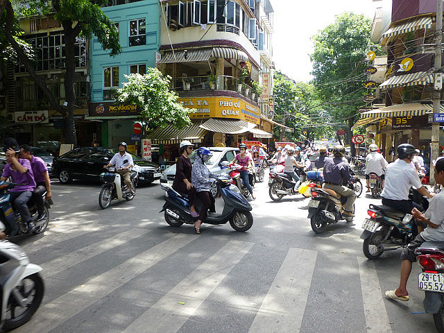 Motorbikes buzz at you from all directions