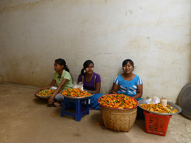 Girls selling pickled mangoes and vegetables