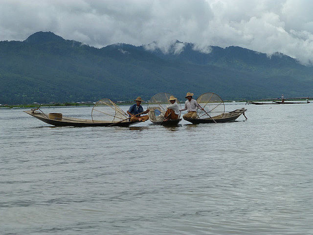 Fishermen with conical nets