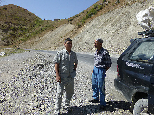 Driver (with cap) and co-passenger