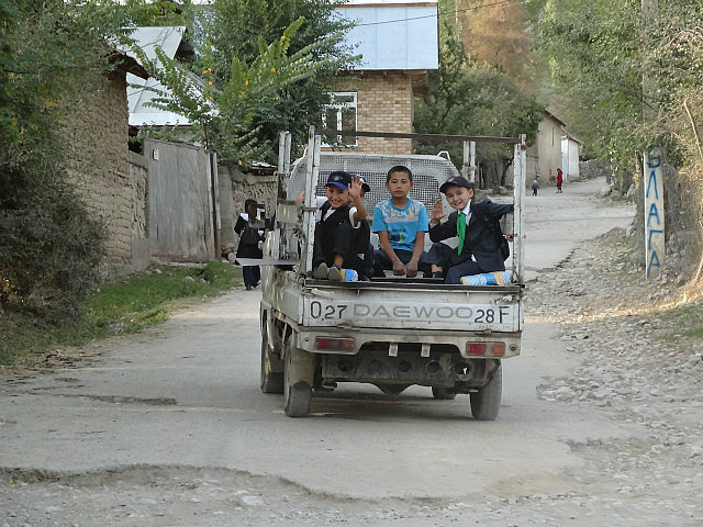 Boys on the back of a truck 