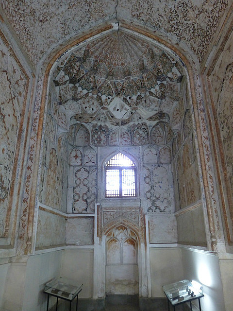 See Abdul Aziz Khan's face in the prayer niche ?