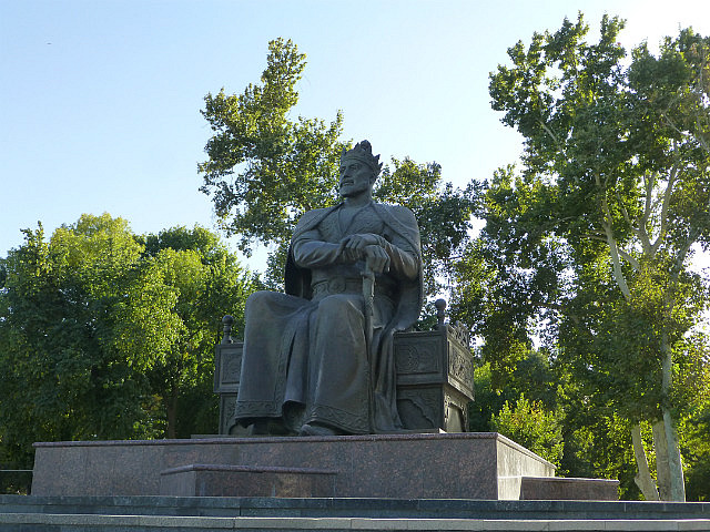 Amir Timur sits regally watching modern Samarqand