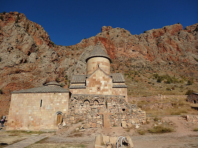 Noravank monastery set against red rock cliffs