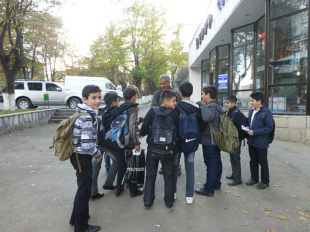 V holding court with Stepanakert schoolboys