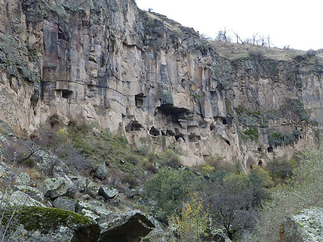 Caves carved into cliffs high up in Ihlara Valley