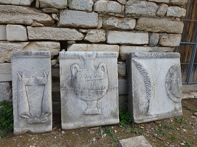 Relief sculpture specifying the wares being sold