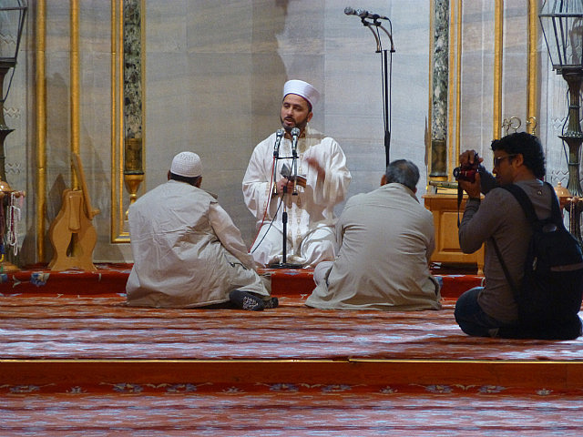 Blue mosque - preacher at work in English