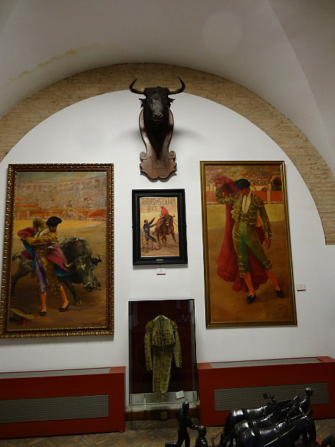 Display showing paintings of champion bullighters