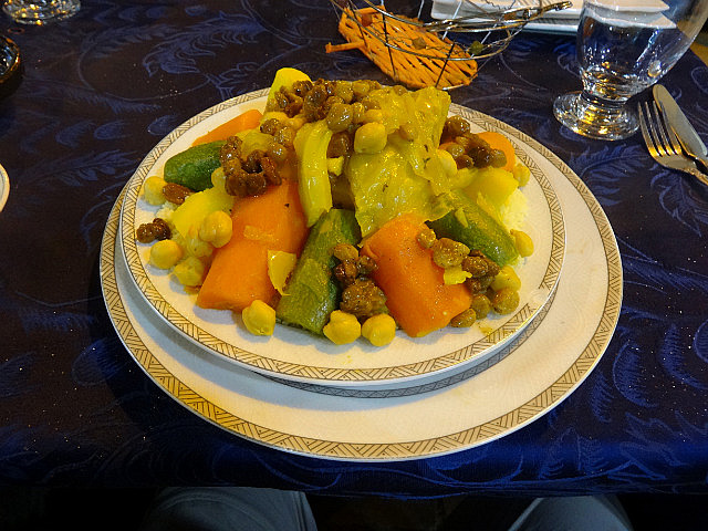 Couscous topped with steamed vegetables