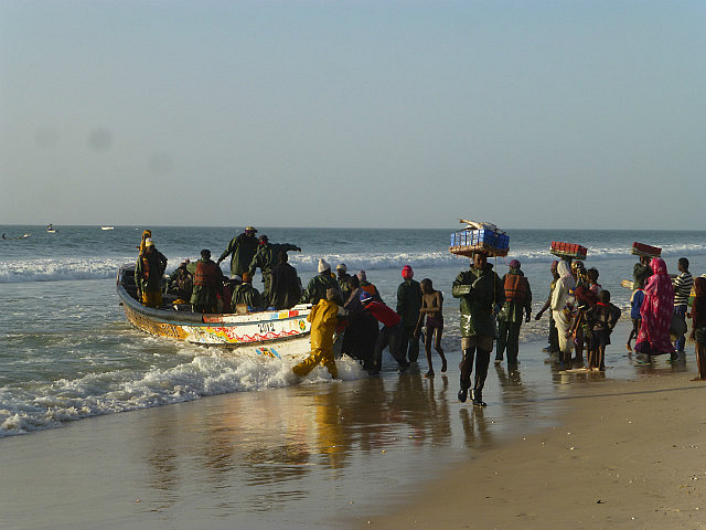 Fishing boat being unloaded