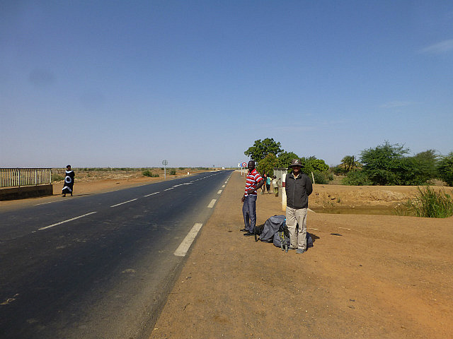 Waiting on the highway for a bus to Saint-Louis