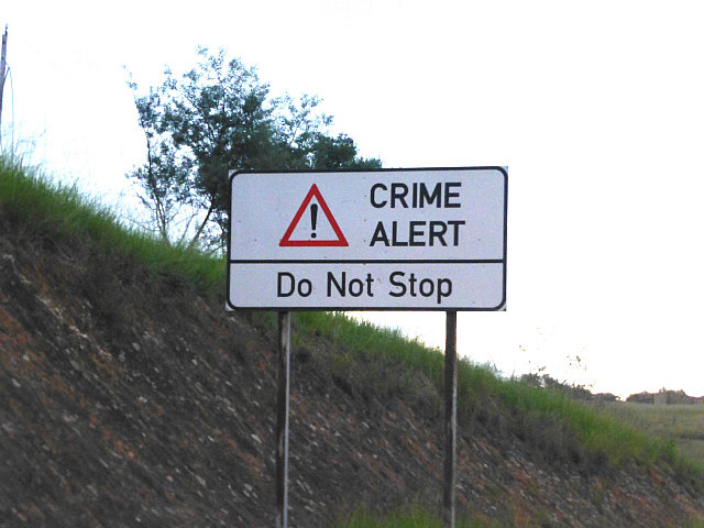 Crime Alert sign on the highway