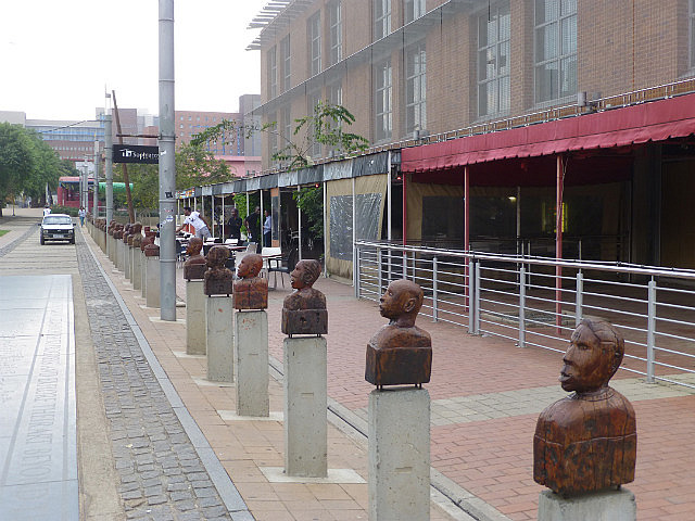 Wooden busts at Mary Fitzgerald Square
