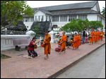 Monks receiving alms