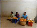 Girls selling pickled mangoes and vegetables