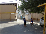 Quiet alleyway with houses plastered with mud