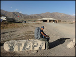 Waiting for the next vehicle to hitch a ride