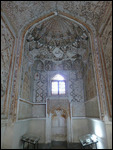 See Abdul Aziz Khan's face in the prayer niche ?