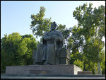 Amir Timur sits regally watching modern Samarqand