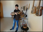 Young man playing the Tar (lute)