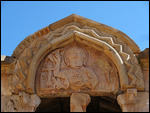 Relief carving depicting Jesus holding a tablet
