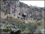 Caves carved into cliffs high up in Ihlara Valley