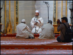 Blue mosque - preacher at work in English
