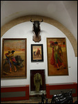 Display showing paintings of champion bullighters