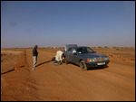 Swapping out a flat tire in the middle of the road