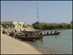 Pirogues waiting to ferry passengers to Senegal
