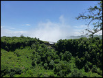 Spume from Vic Falls rises up in the air