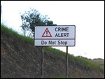 Crime Alert sign on the highway