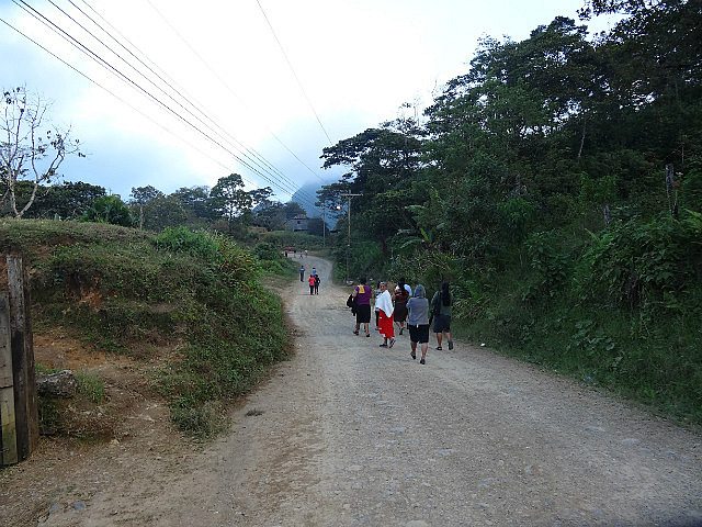 Villagers returning home from church