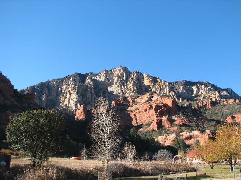 IMG_0795.JPG - Sedona lies at the mouth of Oak Creek Canyon, a distinctive and deep chasm. Rising high above Sedona and its hallmark canyon is the Mogollon Rim, a 2000-foot escarpment formed from ancient deposits of limestone, mudstone and sandstone when the area was the west coast of a still emerging continent.