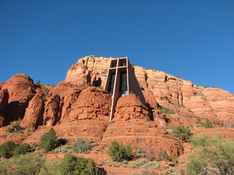 IMG_0807.JPG - South of Sedona is its best known man-made structure, the Chapel of the Holy Cross. The chapel, a wedge of concrete with a 90-foot cross bisecting its face, seems to emerge from the red rocks.