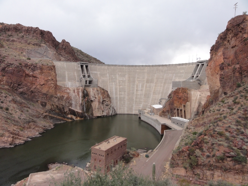 DSC02299.JPG - One of the original five federal projects authorized on March 13, 1903, under the Reclamation or Newlands Act of 1902, Roosevelt Dam was the first major project to be completed under the new federal reclamation program. This, the world's highest masonry dam, was started in 1906 and completed in 1911. As originally conceived and built, it was to be a symbol of success and a showpiece for the new agency. Completed at a cost of 10 million dollars, the primary function of the dam was to provide water storage for the Salt River irrigation project and flood control for the Salt River Valley. The dam contributed more than any other dam in Arizona to the settlement of Central Arizona and to the development of large-scale irrigation there. A secondary purpose of the dam was to generate a moderate amount of hydroelectric power.  In 1989, an ambitious expansion and renovation project was begun at Roosevelt Dam. The original rubble-masonry dam was completely encased in concrete, and the structural height was extended. As a result the dam has a completely altered appearance from when it was originally listed as a National Historic Landmark.