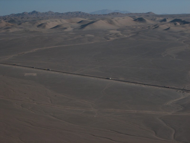 IMG_5298.jpg - From the LanChile aircraft approaching the El Loa airport, Calama. Calama is connected to San Pedro by an excellent highway. The barren landscape stretches as far as the eye can see.