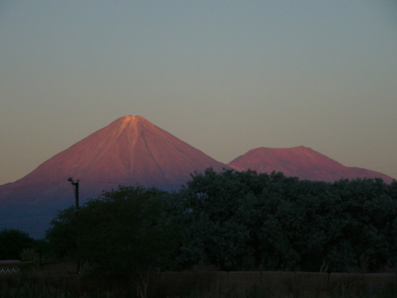 P1080130.JPG - The beautiful and symmetrical Volcan Licancabur (5916m) as seen from San Pedro de Atacama seen in the evening light just before sunset. The Volcano lies on the border between Chile and Bolivia with the peak shared by both countries.