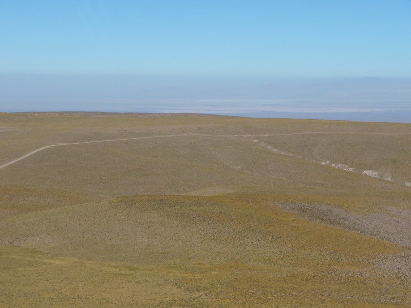P1080393.JPG - The Salar de Atacama can be seen in the distance at a lower elevation.
