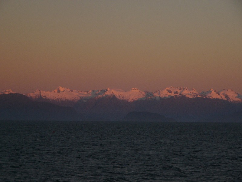 P1080800.JPG - 8 pm: After our first dinner on board. The Andes mountains glow red at sunset.