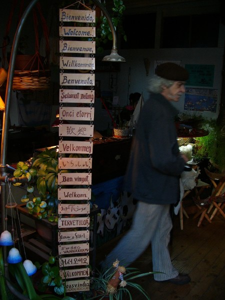 P1090366.JPG - Neighborhood workshop displays welcome message in number of languages.  To our surprise, the fourth from the bottom was in Tamil.