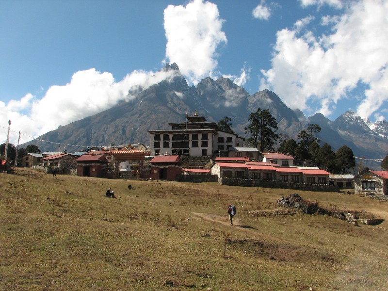 IMG_8154.JPG - Tyangboche Monastery with trekkers relaxing in front on the large meadow.