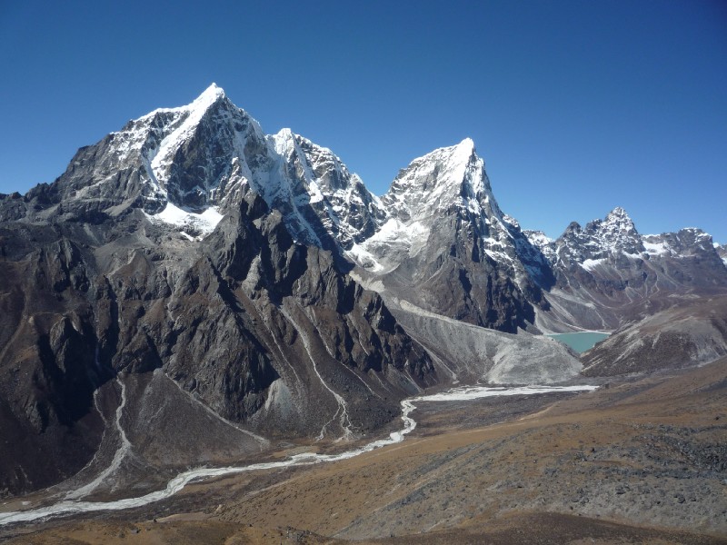 P1000528.JPG - Khumbu Khola Valley from Nangkartsang peak (looking west). This could easily be the most fabulous view of the entire trip. Tawoche (only partially seen at left edge), Cholatse (the mountain tilting to the right), the Cholatse Pokhari lake, the Khumbu Khola river (white threads on the valley floor) and the mountains in the far distance. None of these have star power, but this view was simply mesmerizing.